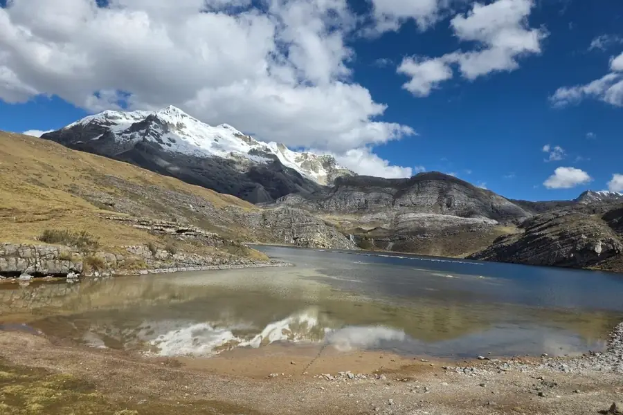High-Andean lake facing a snow-covered mountain