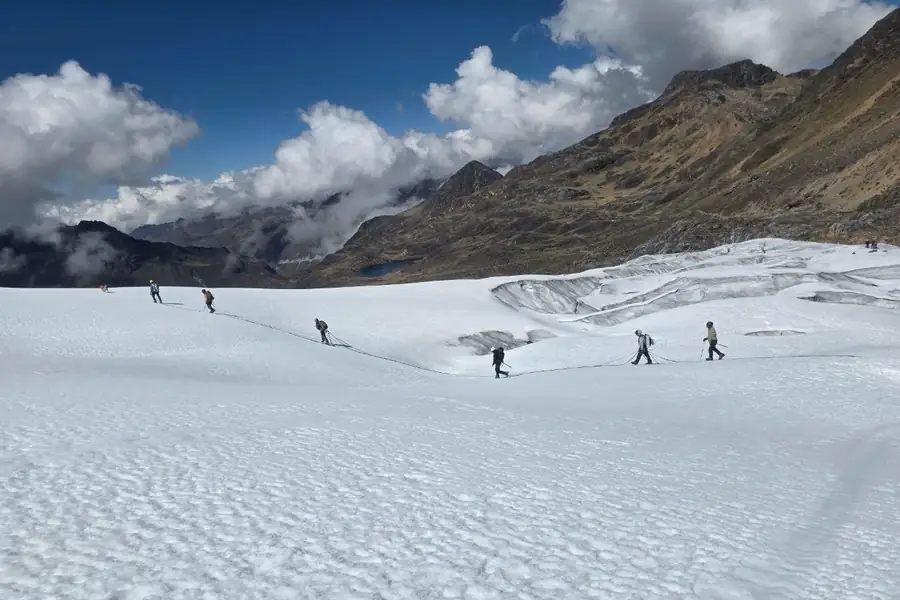 Field team walking across a snow surface