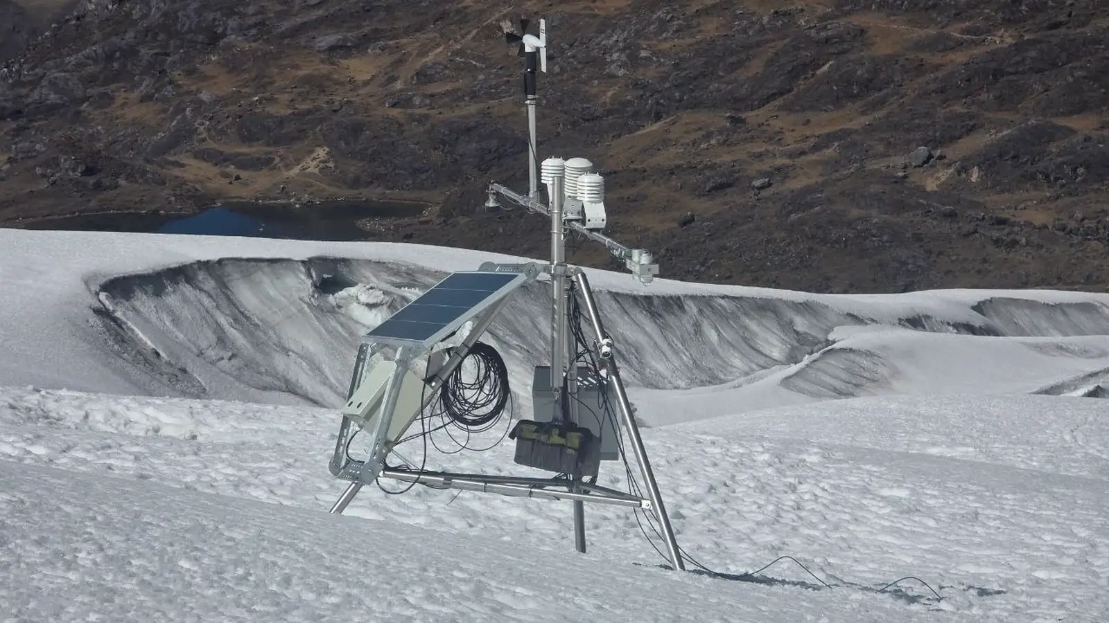 Automatic weather station installed on a high-mountain glacier surface